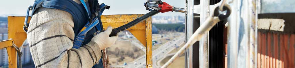 Pre-Engineered Metal Building Erector Working On A New Steel Building