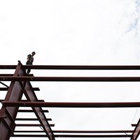 Steel building erectors working together